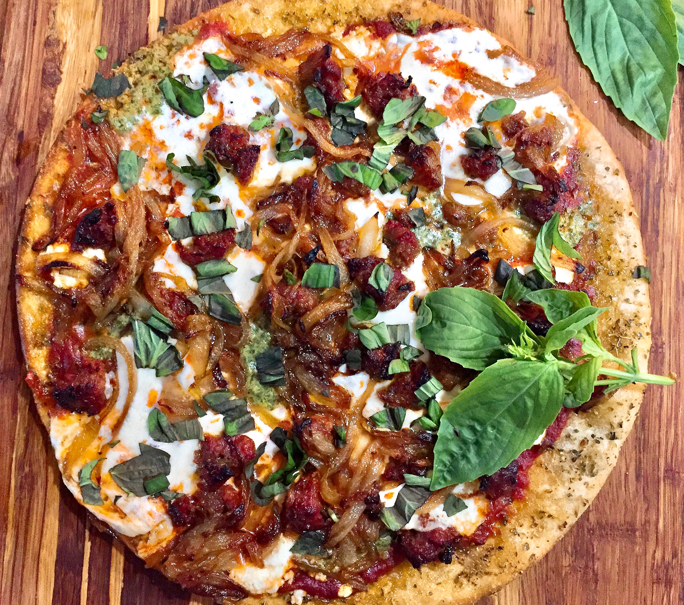 Hot Italian Sausage, Caramelized Onion, and Pesto Pizza