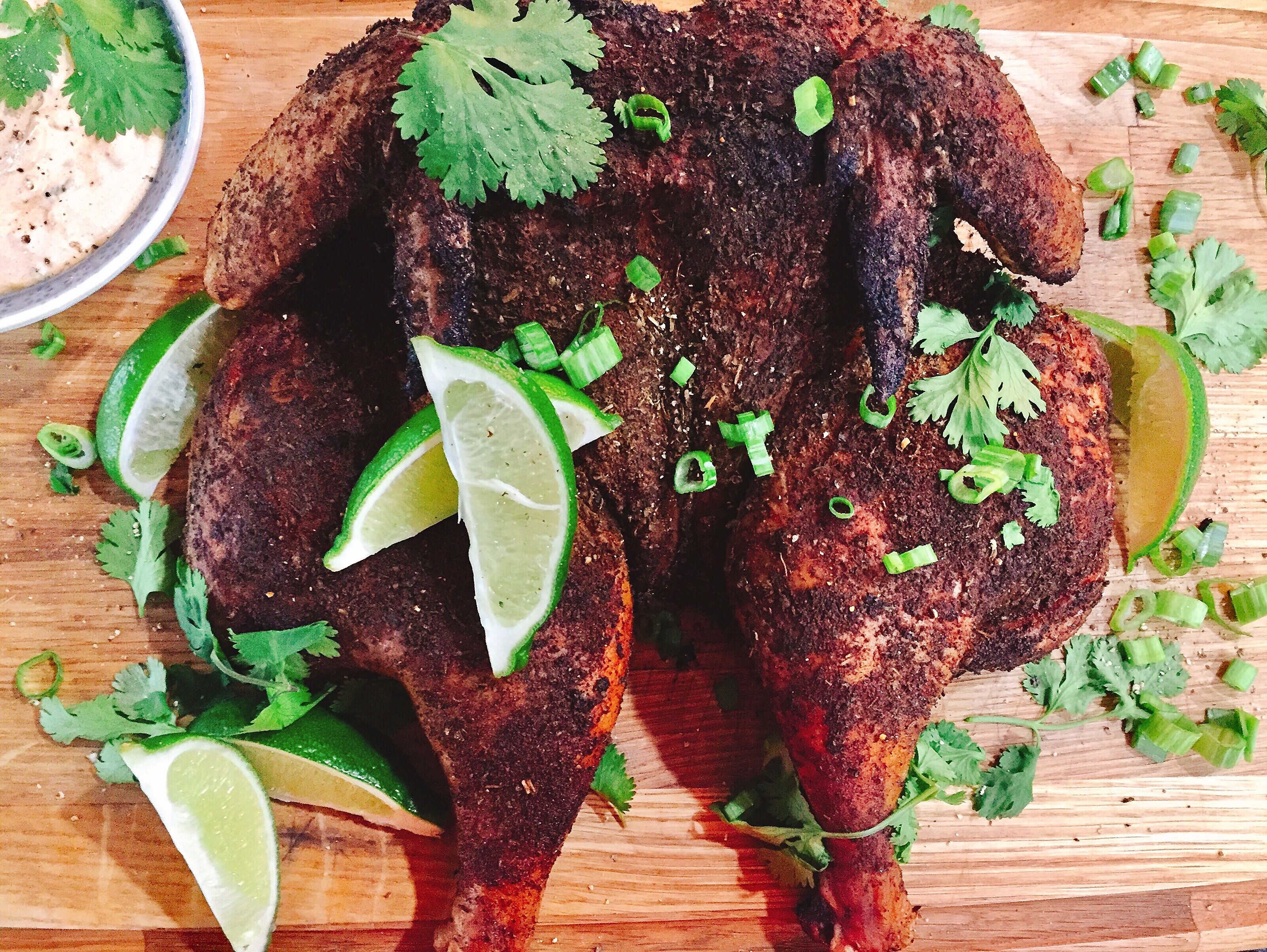 Southwest Spatchcock Chicken with a Chipotle-Lime Crema via A Hint of Wine