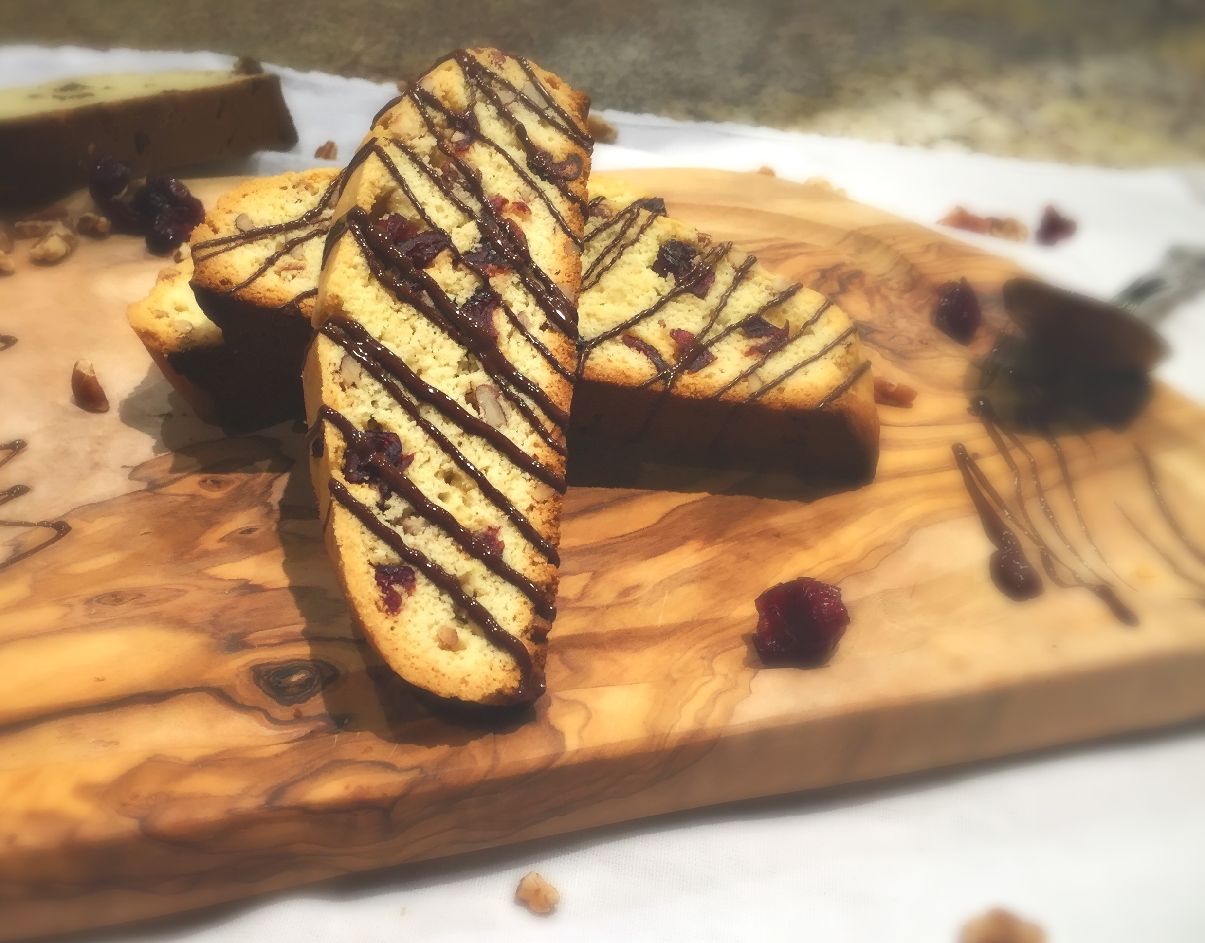 Pecan and Cranberry Holiday Biscotti with a Dark Chocolate Drizzle