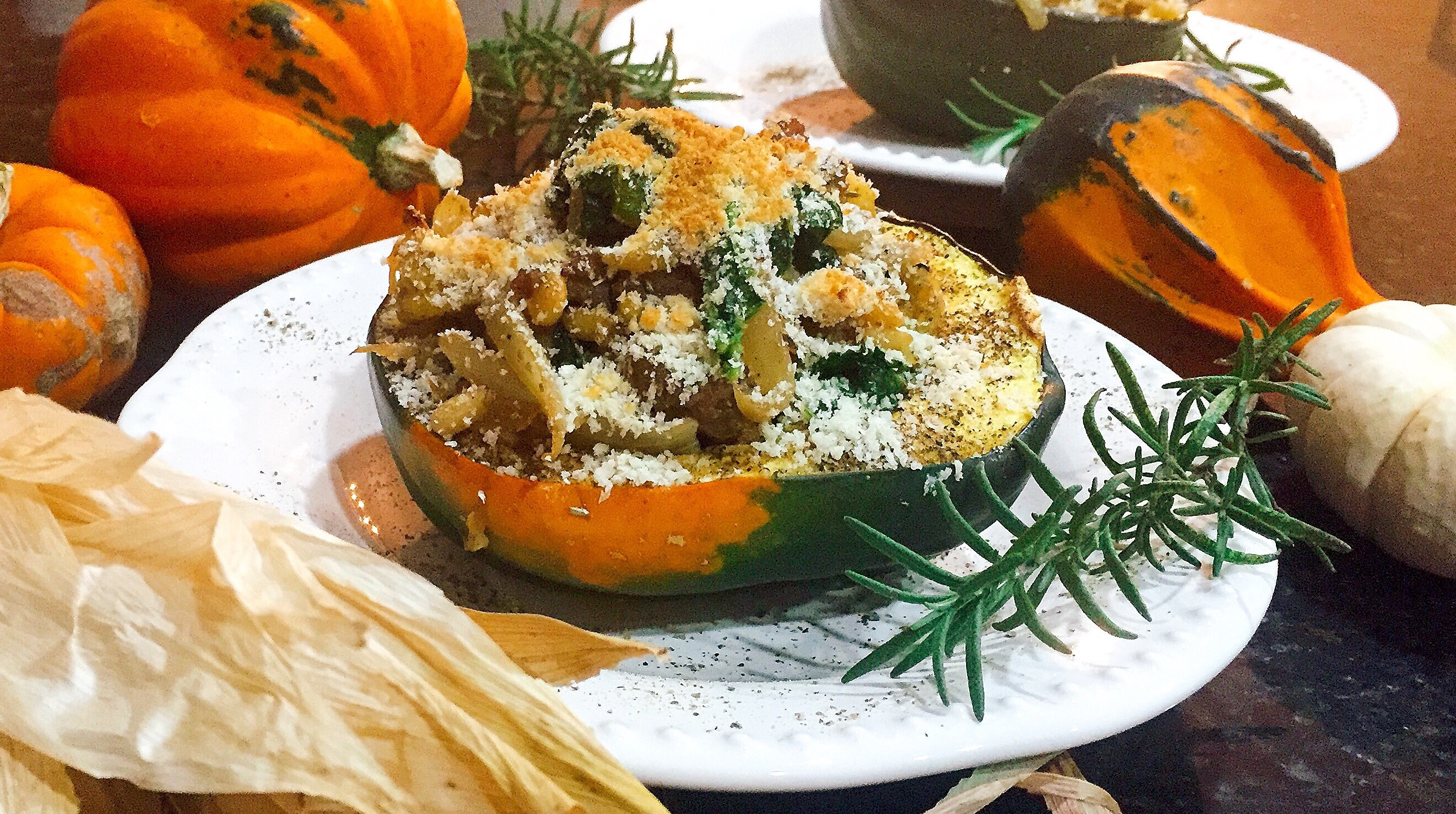 Sausage and Kale Stuffed Acorn Squash with a Parmesan Breadcrumb Topping